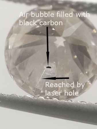 diamond with carbon filled spot, laser tunnel to it diamond with carbon filled spot, laser tunnel to it